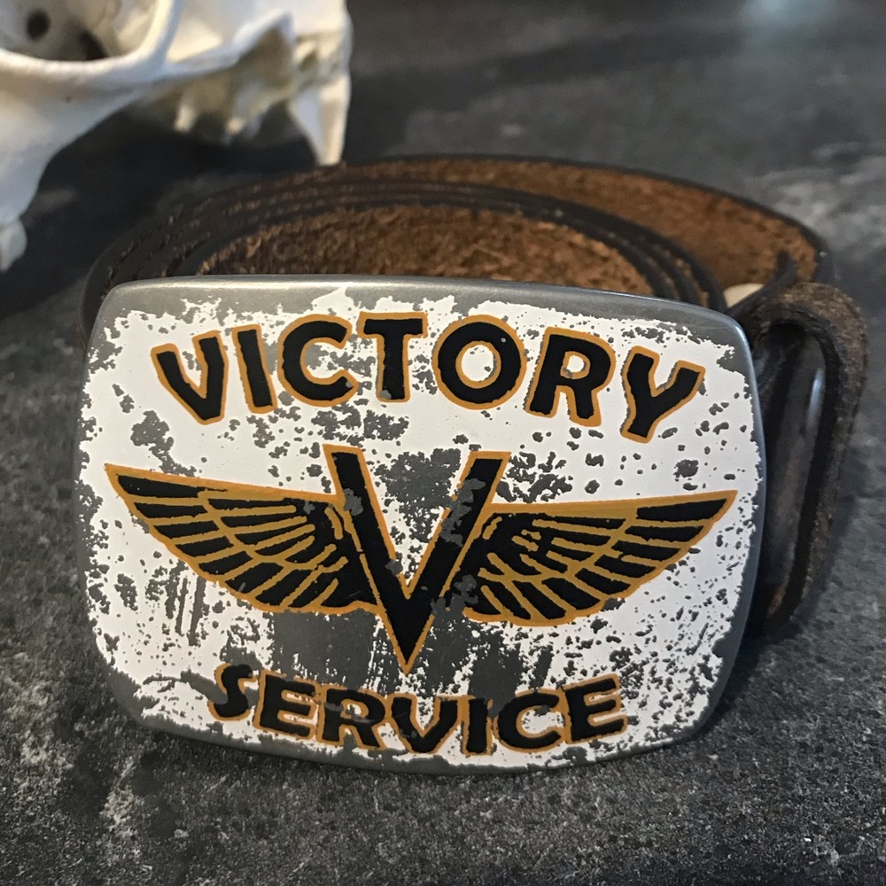 Belt buckle with brown leather belt